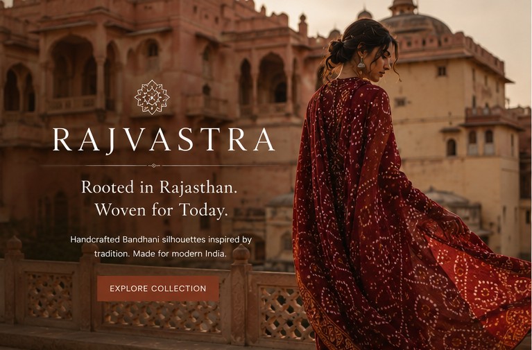 Hero section design: Rajvastra logo, 'Rooted in Rajasthan. Woven for Today.' and an Explore Collection button